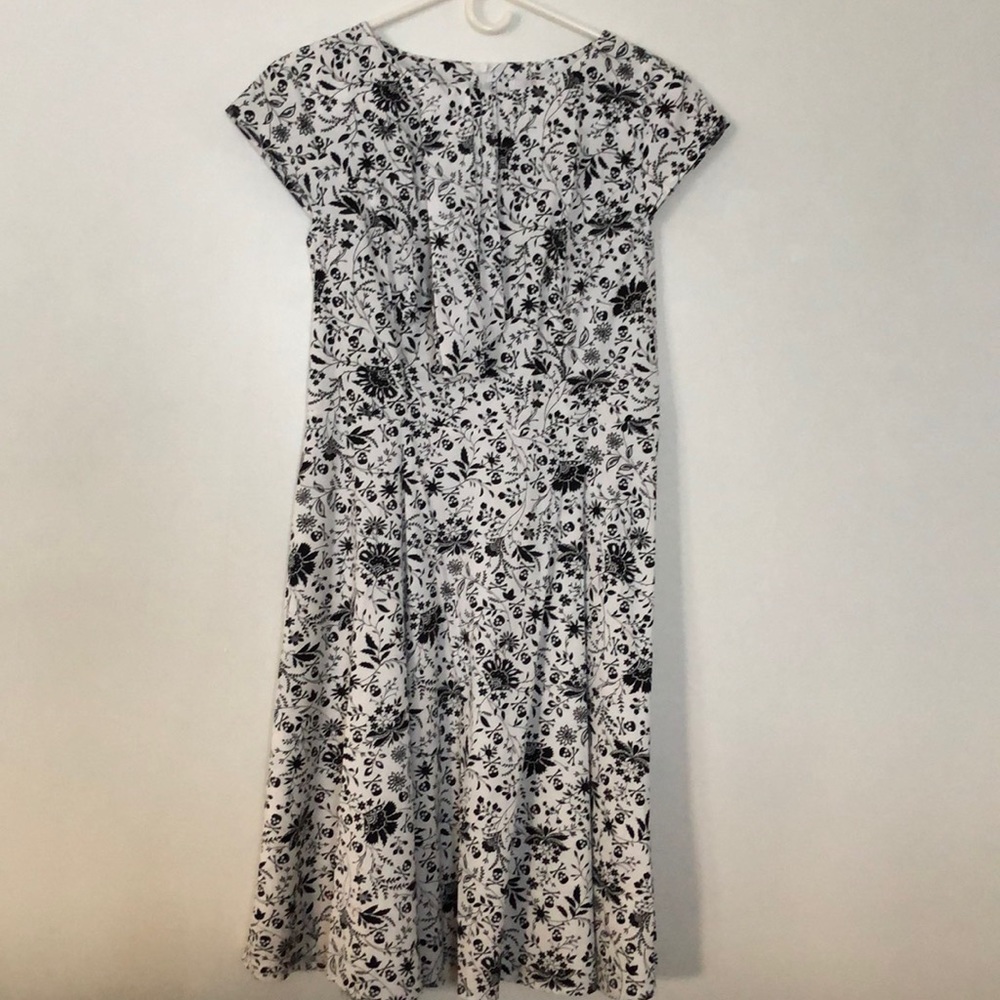 Skulls and Roses dress never worn and perfect condition. Large but fits 8/9.